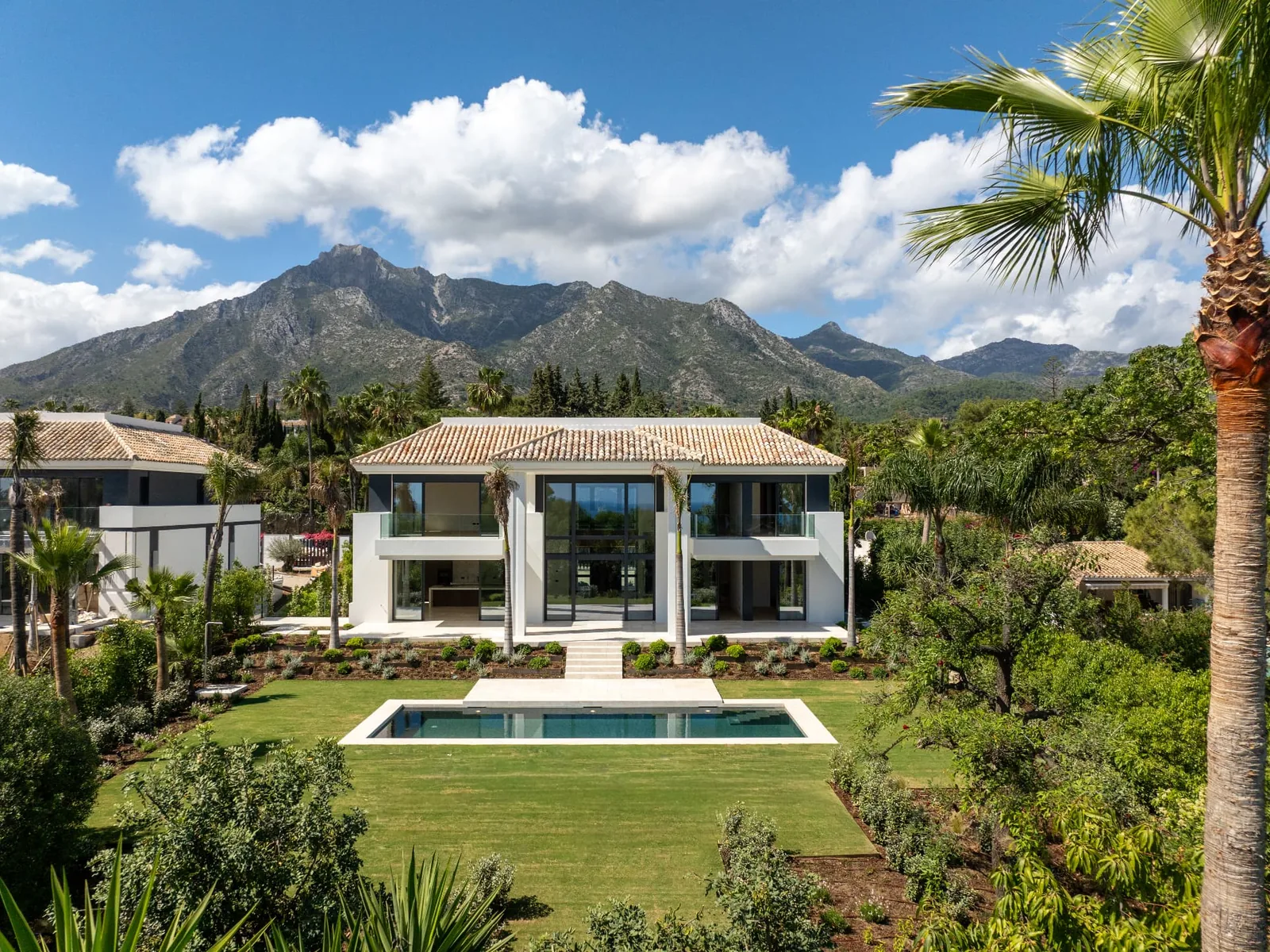 Benahavís village surrounded by lush green mountains and golf courses